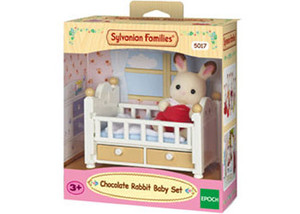 Sylvanian Families Chocolate Rabbit Baby Set with white cot, yellow drawers and rabbit figure in display packaging