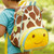 Skip Hop Zoo Giraffe Toddler Backpack side view mesh bottle pocket