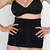Angel Maternity black tummy control belly band shapewear worn over underwear, shown on torso with hands on hips
