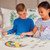 Orchard Toys Rainbow Unicorns - unicorn matching cards fanned out showing rainbow colour range
