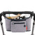 Skip Hop grey stroller organiser with black trim attached to handlebar, holding drinks, toy and accessories with front
