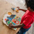 First Shapes Jumbo Knob Puzzle pieces removed showing colourful images beneath
