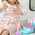 Child using Melissa and Doug play nail buffer from nail care set