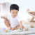 Plan Toys Baby Sensory Tumbling Faces set on play mat