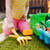 Let's Explore Gardening Set showing pretend vegetable harvest pieces - carrots and tomatoes