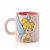 Disney Gifts pink ceramic mug featuring Tinker Bell character with blonde hair, blue wings and green dress on white
