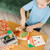 Top and Bake Pizza Counter wooden serving accessories and pizza slice pieces