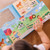 Farm Puzzle wooden pieces fitting into illustrated puzzle board background