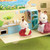 Sylvanian Families Caravan with figures enjoying camping play scene