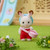 Chocolate Rabbit Baby figure with accessories and product packaging