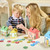 Orchard Toys Peter Rabbit Posting Game in play showing toddler posting character cards
