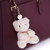 Chic & Love Bailey Bear Bag Charm & Aquamarine Birthstone Necklace March - lifestyle and in-use view | Peekaboobaby