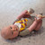 Harry Potter Dobby Baby Foot Rattles - lifestyle and in-use view | Peekaboobaby