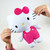 Hello Kitty super soft squishy plush 26cm held in hands showing soft stretchy texture, pink bow
