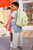 Skip Hop Besties Squad Dino Backpack - lifestyle shot worn by child at kindy showing scale and fit