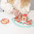 Peppa Pig Wooden Tea Set - child in cream sweater playing with mint tray, wooden cups and Peppa Pig teapot with wooden play food items | Peekaboobaby