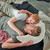 Theraline Plushy Moon Cream - adult and child resting together with pillow comfort support for everyday cuddles