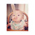 Toddler holding pink Beaba silicone spoon up to face