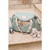 Beaba Sydney II sage nappy bag flat lay with bottle, toy and accessories