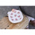 Child's hands holding Beaba Big Love white heart-patterned meal box with handles
