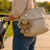 Jamie the Bunny keychain attached to cream tote bag, lifestyle shot