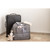 Beaba Amsterdam II grey changing bag beside black wheeled suitcase with plush toy