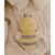 Bubble Bumble the Bee plush toy flat lay on quilted fabric, close-up