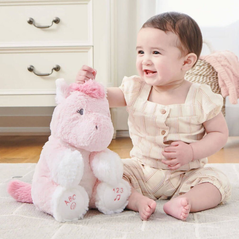 GUND Animated Alora Unicorn toy with packaging showing features