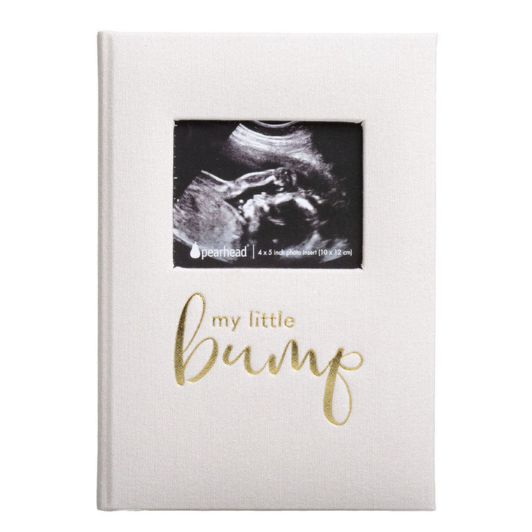 Pearhead linen pregnancy journal in white with gold 'my little bump' text and ultrasound photo insert window on front cover.