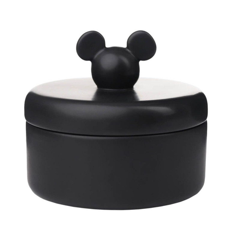 Black matte ceramic Disney Mickey Mouse storage jar with round ears lid handle on white background