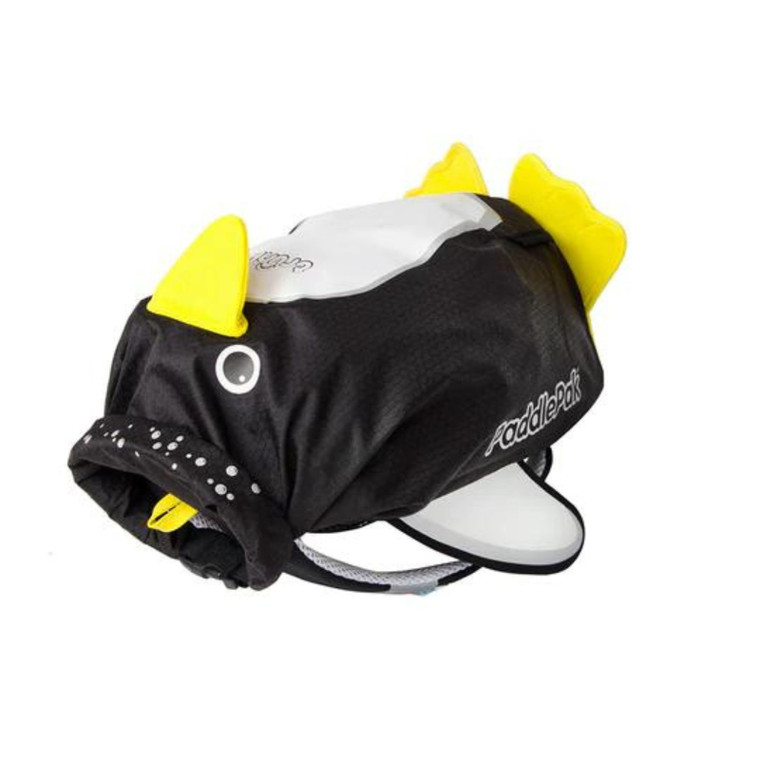 Trunki Paddlepak black and yellow penguin-shaped water resistant backpack with white face and fin details shown at an angle