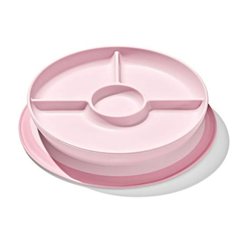 OXO Tot pink suction divided plate with three compartments and central dipping bowl on white background