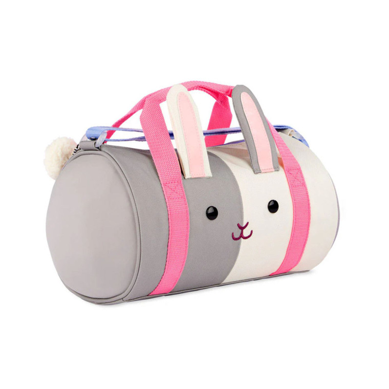 Skip Hop grey and pink bunny-shaped kids duffel bag with pink webbing straps and pom-pom tail against white background