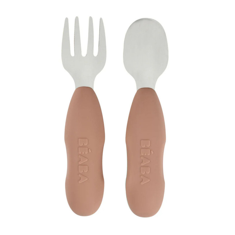 BEABA stainless steel fork and spoon set with soft pink handles embossed with brand name on white background