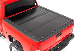 Rough Country Low Profile Hard Tri-Fold Tonneau Cover 07-13 1500 5.5 Foot Bed w/Rail Caps  47113551