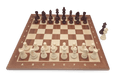 Wooden chess pieces displayed on board