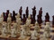 Berkeley Chess Mandarin (Red) Chessmen pieces (BC3005) red and white on board