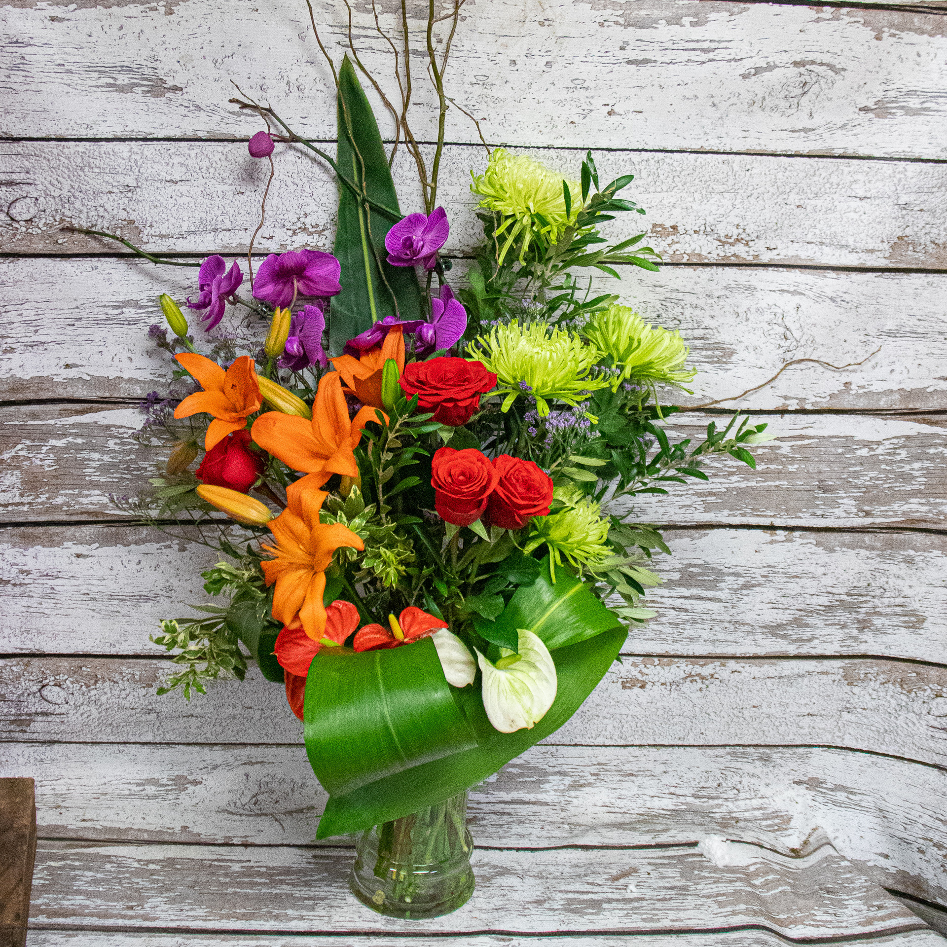 A Tropical Rose Vase Arrangement Loveland Flower Delivery Earle s