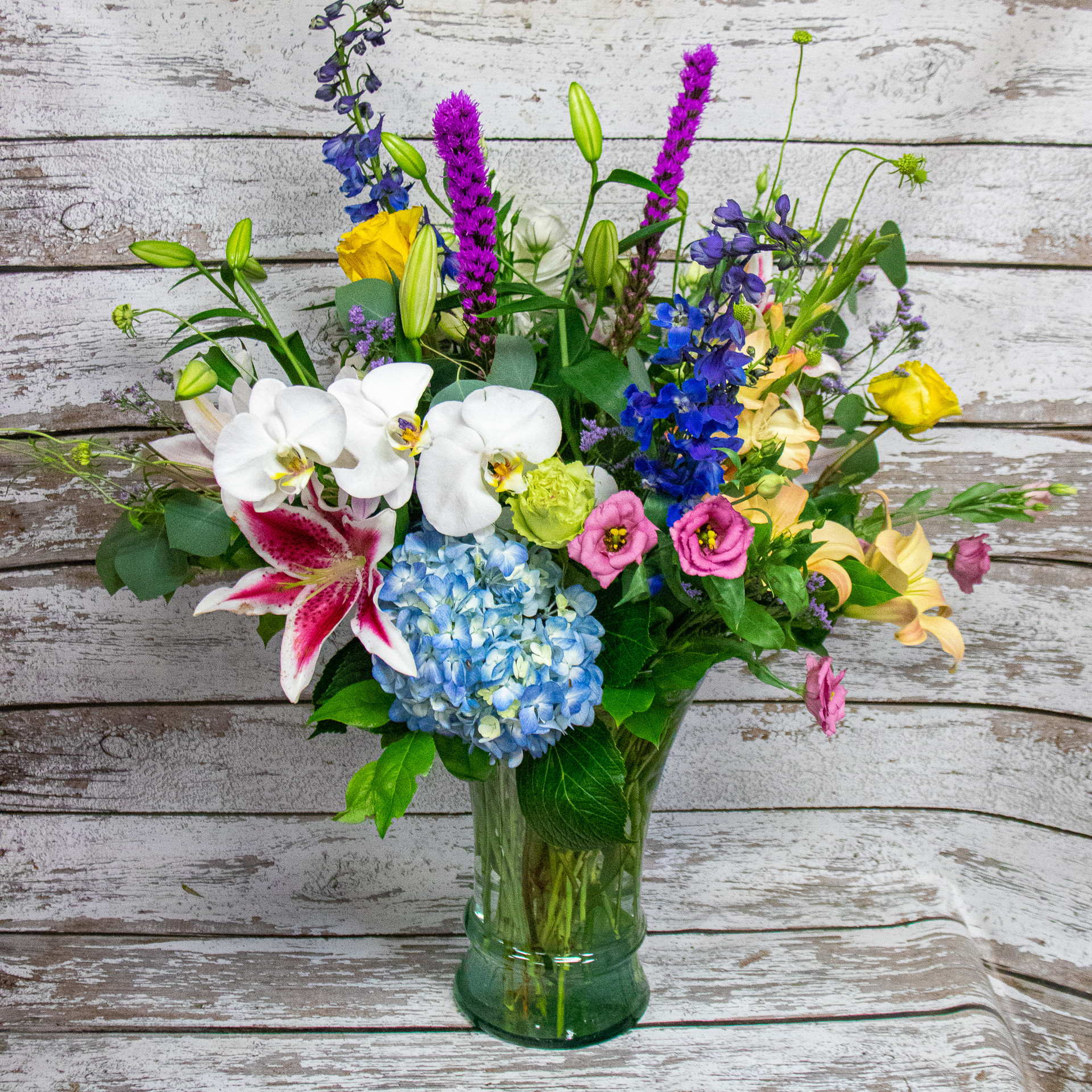 A Tropical Rose Vase Arrangement Loveland Flower Delivery Earle s