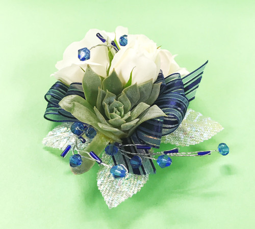 Be bold with a succulent design. Fresh flowers mixed with awesome succulent details designed by your Loveland Florist