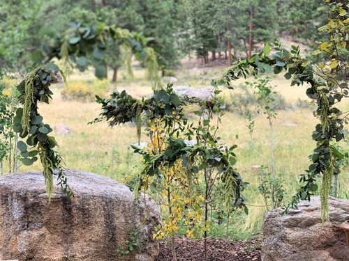 A gorgeous, simple, large gold ring designed with mixed greens and eucalyptus. Great for indoor or outdoor decor.