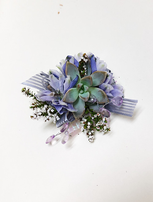 Succulent corsage with wlavender flowers, ribbon and sparkle