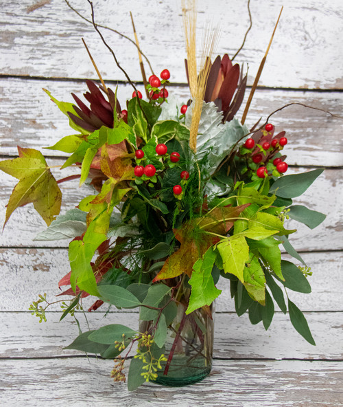 This arrangement full of fall foliage will add a taste of autumn to your home.