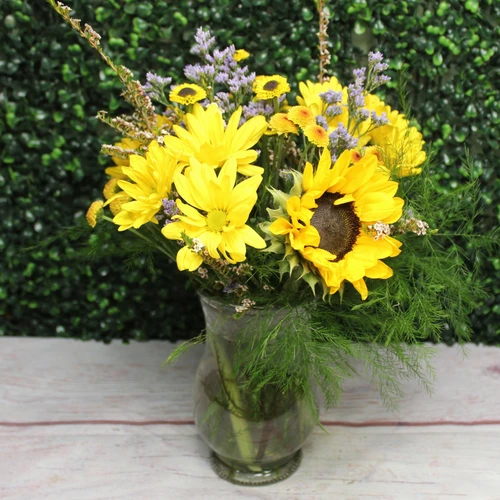Cheerful yellow flowers in a vase