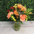 Small fall flower arrangement in a vase
