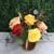 Six fall colored roses in a vase