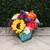 Fresh flower arrangement in a cube-shaped container