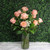 One version of the Traditional Rose Arrangement with peach roses in a vase