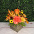 Fall flower arrangement in a rustic wooden box