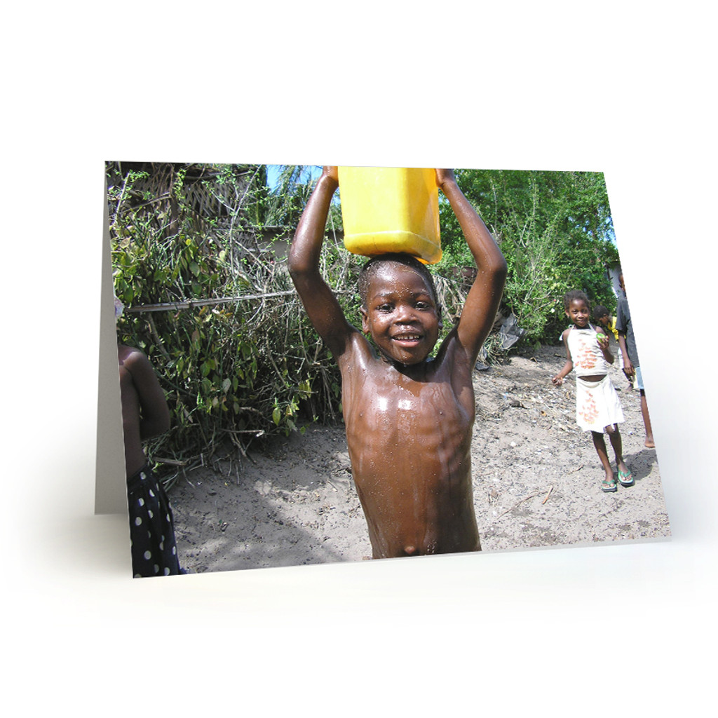 Young Boy Carries Water in Mozambique